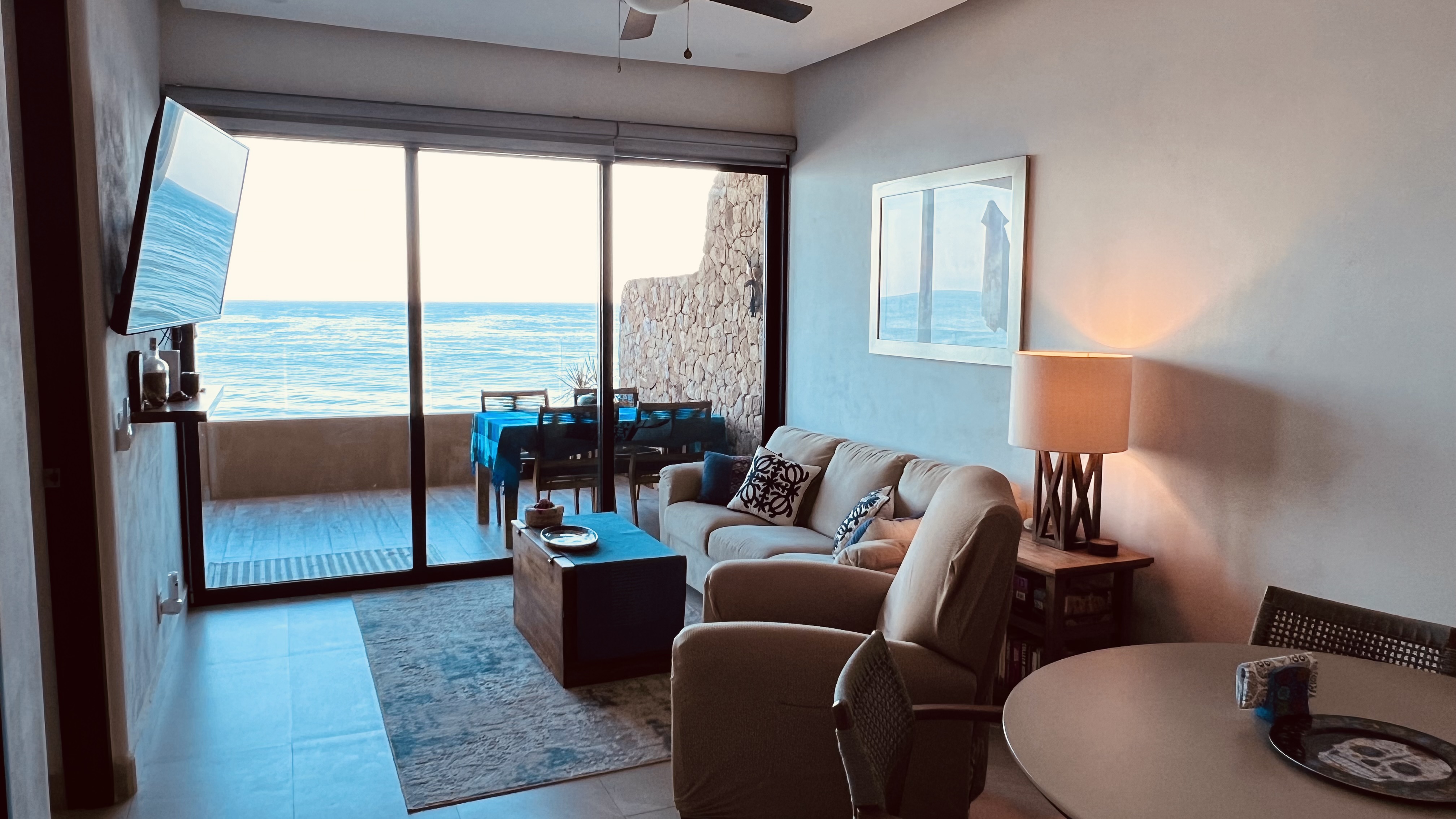 Our bright and inviting coastal-inspired living room is the perfect place to gather, relax, and reconnect after a day at the beach. Thoughtfully designed with a blend of modern comfort and laid-back coastal style, this welcoming space features a plush sofa, comfortable recliner, and plenty of seating for family and friends.