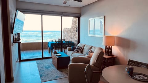 Our bright and inviting coastal-inspired living room is the perfect place to gather, relax, and reconnect after a day at the beach. Thoughtfully designed with a blend of modern comfort and laid-back coastal style, this welcoming space features a plush sofa, comfortable recliner, and plenty of seating for family and friends.
