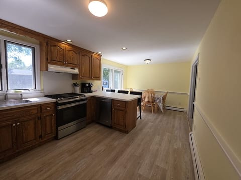 Kitchen opens to bright dining area