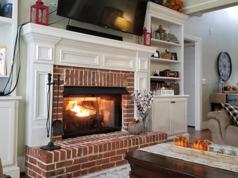Shared living room with gas fireplace.