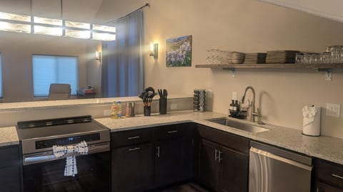 Modern kitchen with stainless appliances and spacious breakfast bar