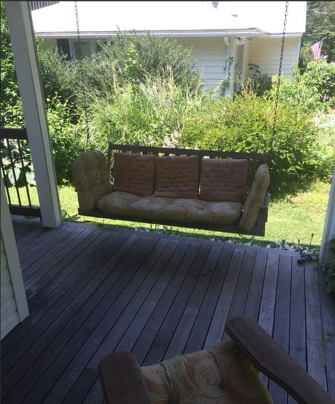 Or watch the kids play across the street at the neighborhood playground from the porch swing.
