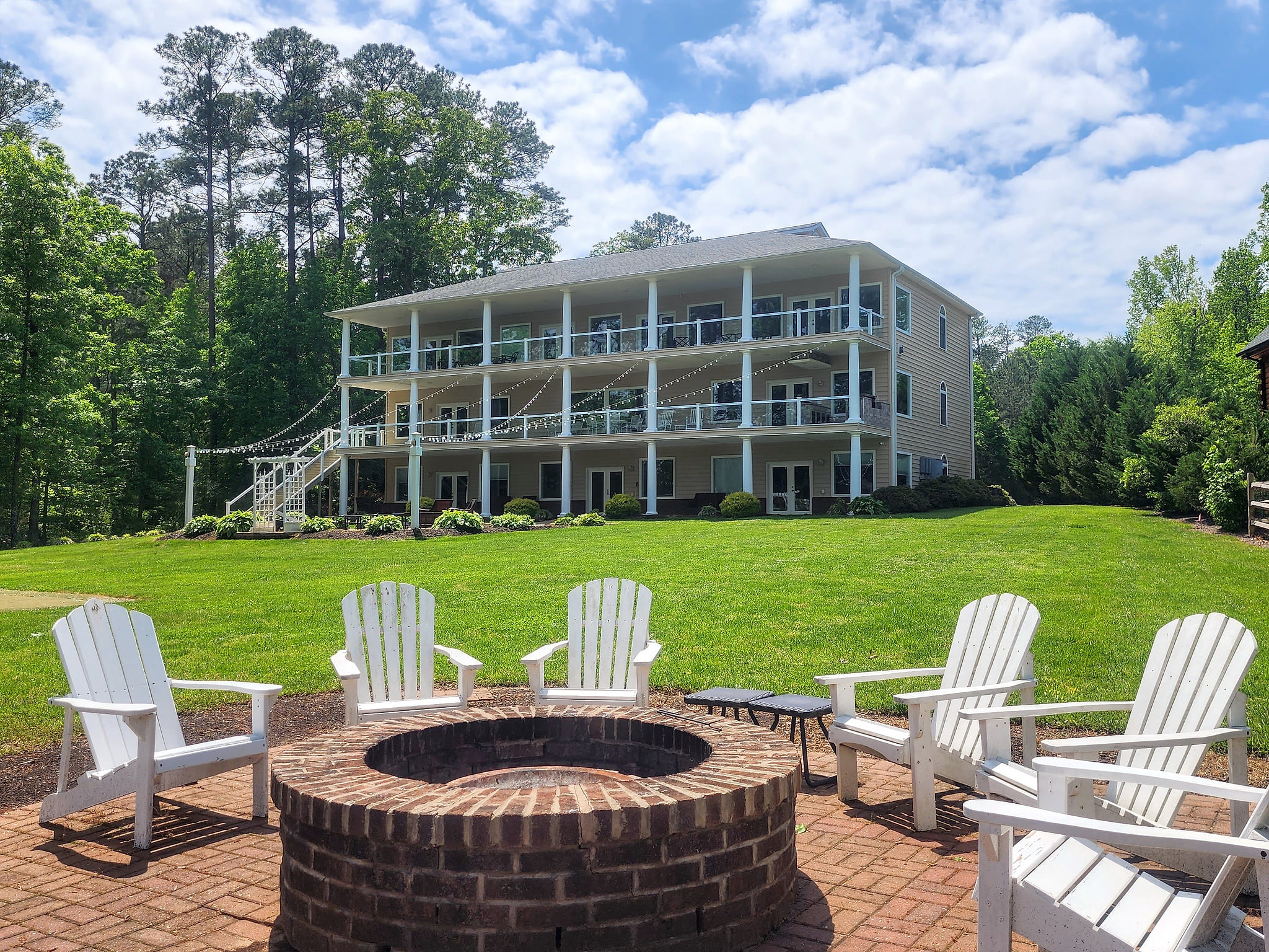 Our waterfront home. Large gently sloping grass backyard on the water.