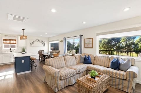 Spacious living room upstairs open to the kitchen and dining room.