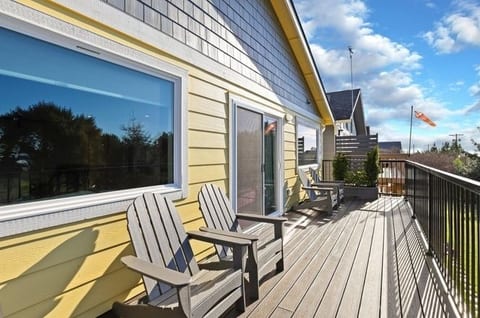 Large patio with outdoor furniture and propane bbq grill.