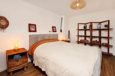 Master bedroom on the first level with its private shower room.