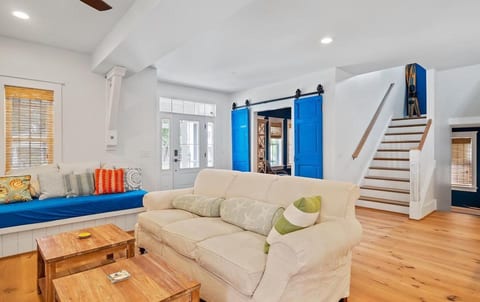 Great Room Living room area with built in sofa.  Main Entrance of Home.