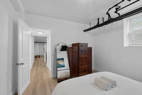 Bright minimalist bedroom with industrial charm and smart storage