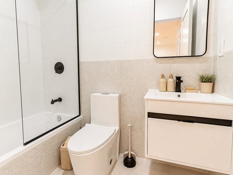Modern bathroom with full shower and sleek fixtures offers a spa‑like start to your day.