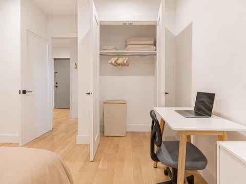 Bedroom closet area with essentials and storage keeps your belongings organized and tidy.