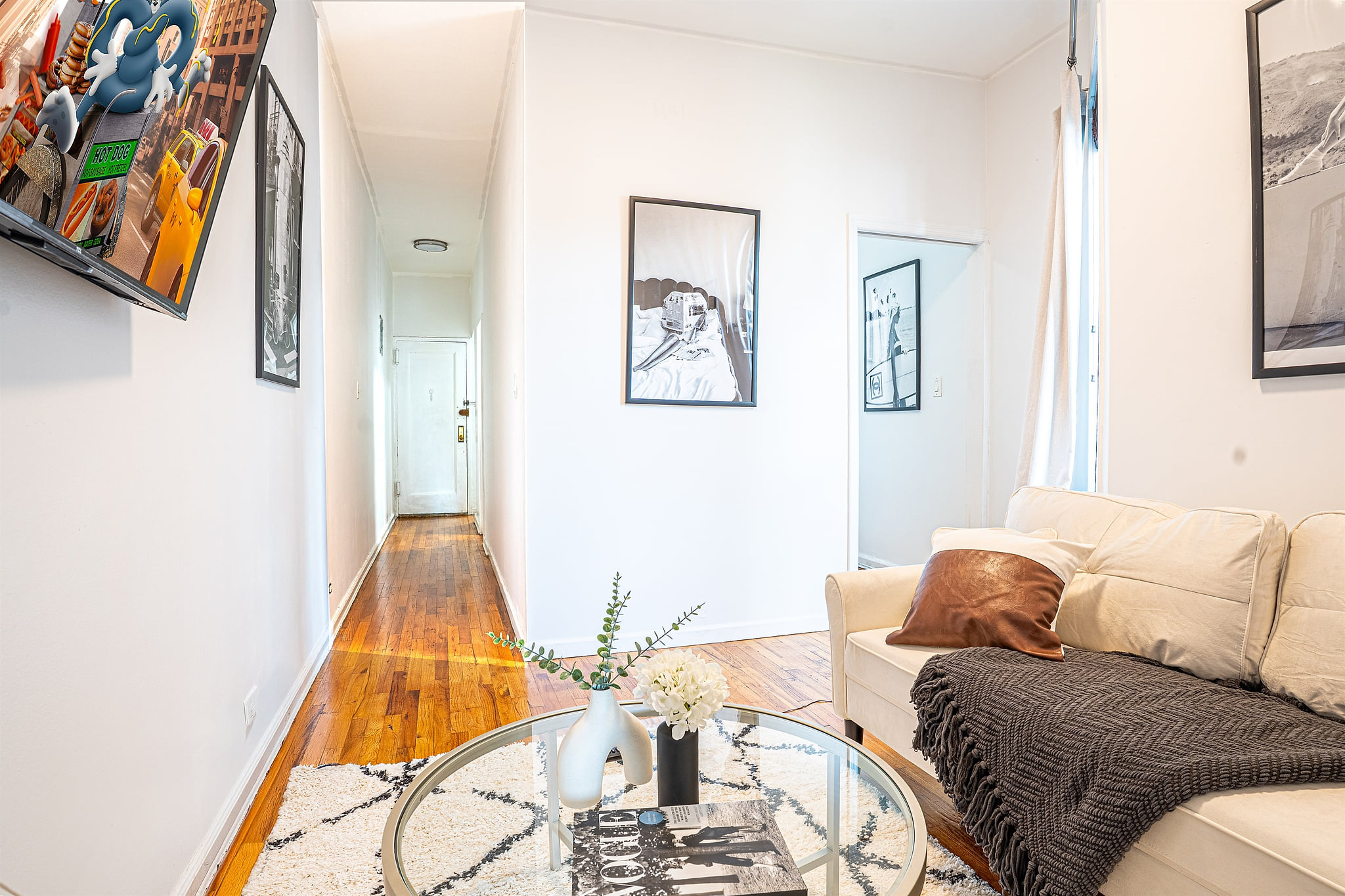 Modern lounge with sofa, TV, and chic decor accents