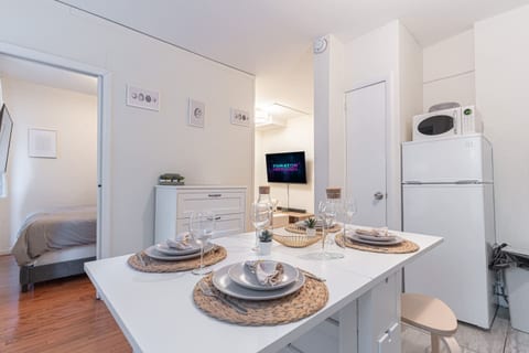 Fully equipped chef's kitchen with full-size appliances, cookware, and counter prep space — cook in or order from NoMad's top restaurants.