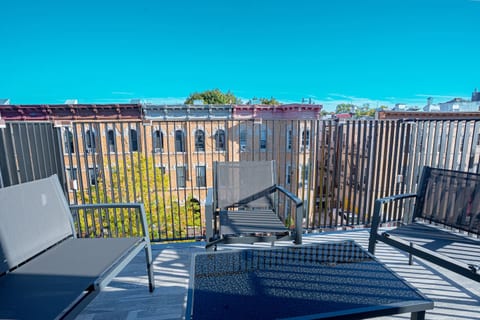Private balcony overlooking the street—sip coffee or wine while soaking up the Bushwick vibe.