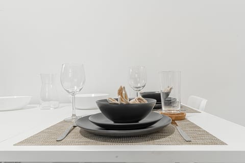 Dining table set and ready — plenty of room to eat in together after a day exploring the city.