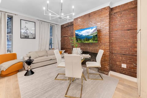 Bright NoMad living room with smart TV and contemporary decor — your stylish 3BR retreat in the heart of Manhattan.