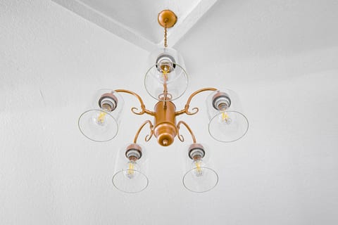 Designer copper pendant lighting adds warmth and character to your studio retreat.