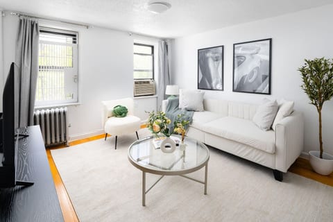 Bright kitchen with stainless appliances & stylish dining for four