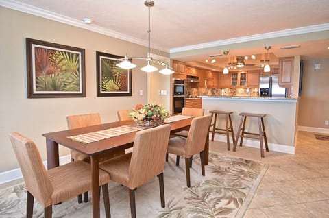 The open dining area comfortably seats six and flows seamlessly into the beautifully updated kitchen.