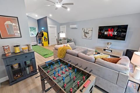 Game room fun with foosball, arcade games, putting green & big-screen TV