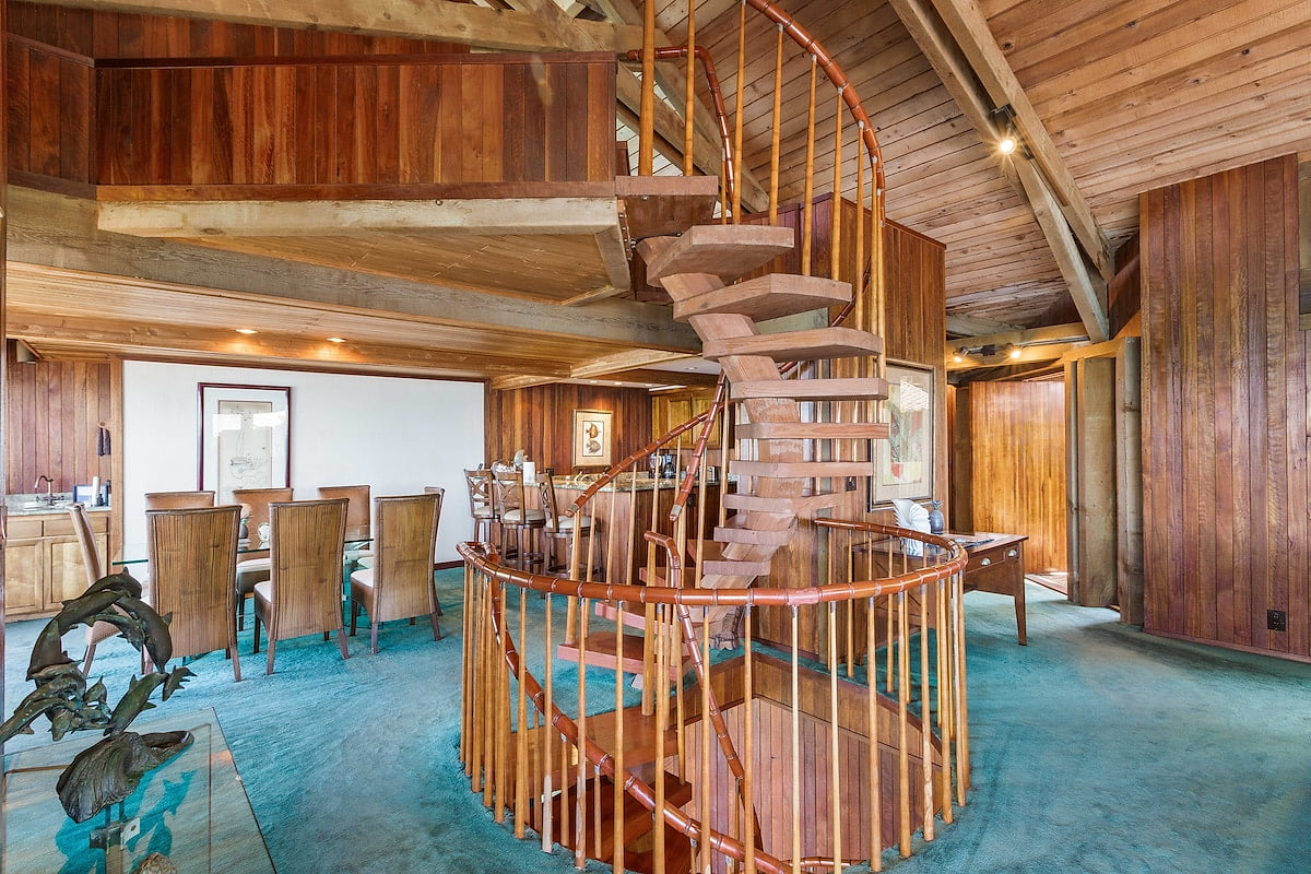 Steel reinforced spiral stairs connects the upstairs loft with the main living area and the downstairs entertainment area.
