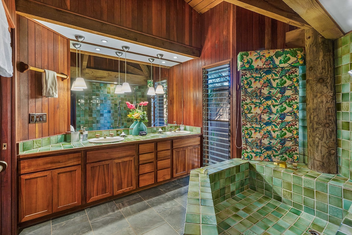 The spacious master bath features dual sinks, a large soaking tub, and shower.