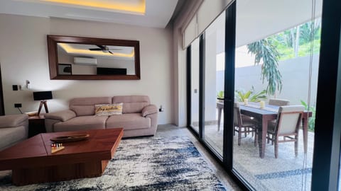 Sink into the plush sofas and comfortable chairs while enjoying your favorite movie or sporting event on the large smart TV. A quiet ceiling fan keeps the space cool and breezy, creating the perfect spot to unwind, read a book, or spend quality time with family and friends.