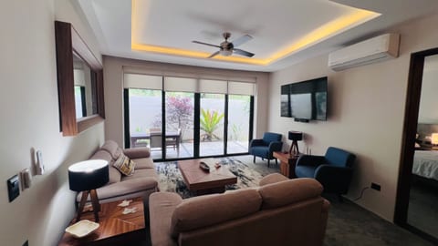 The inviting living room is designed for both comfort and relaxation after a day at the beach.