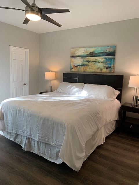 Master bedroom with walk in closet and private upstairs private balcony slider doors. Electronic security shutters offers complete darkness when needed for sleeping in.