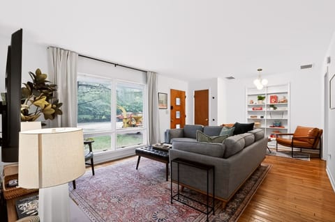 Comfy gathering space with 65-inch TV, Super Nintendo mini-gaming system, board games and books