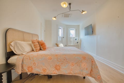 King sized bed on the upper floor of duplex complete with en-suite bathroom with heating floors for additional comfort.