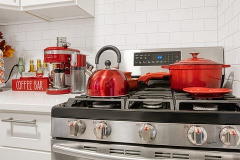 Fully stocked kitchen with stainless steel appliance, dishwasher.