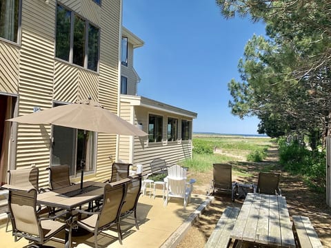 Private outdoor patio with dining area,Adirondack and lounge with water views. 
