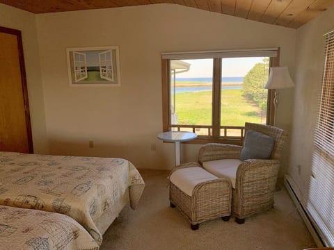 Third floor (top floor) with large bedroom with 4 twin beds with water views.