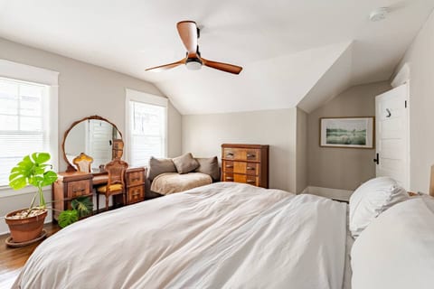 Comfortable bedroom with soft lighting, warm décor, and a relaxing atmosphere. Perfect for a quiet night’s sleep after a day of dining, breweries, and exploring the area.