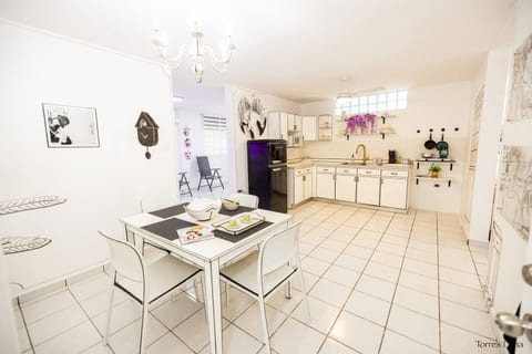 Unique black-and-white cartoon-style dining and kitchen area, an eye-catching space perfect for fun photos, shared meals, and unforgettable moments. Fully equipped for everything from breakfast to late-night ramen.
