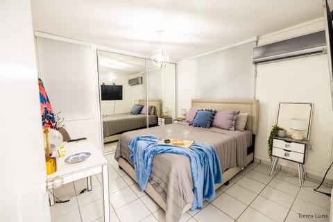 Cozy master bedroom with soft lighting, plush bedding, and a warm relaxing vibe. Perfect for unwinding after a day at the hot springs or exploring the town. Designed for comfort and peaceful nights.