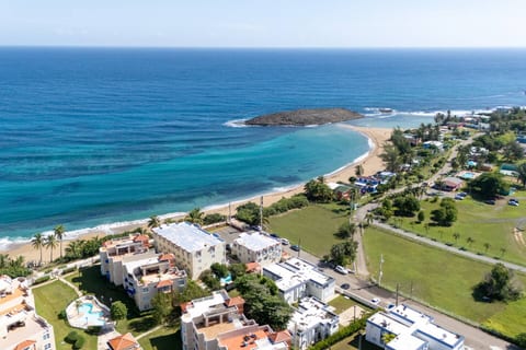 A stunning coastal setting with crystal-blue waters and golden sand just minutes from the property perfect for relaxing beach days.