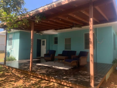 A spacious covered patio with cozy seating and shaded comfort perfect for relaxing outdoors any time of day.
