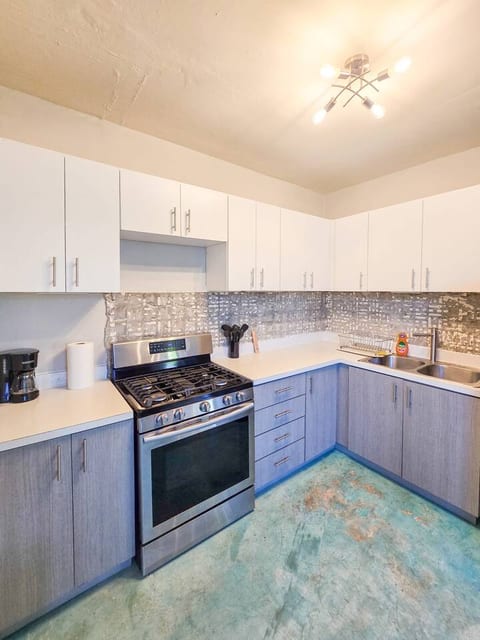 Clean and functional, this kitchen features ample counter space, a full-size stove, and all the basics for comfortable cooking.