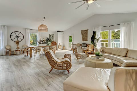 Enjoy the spacious open concept dining and living area, thoughtfully designed for hosting meals, connecting with loved ones, and creating lasting vacation memories.