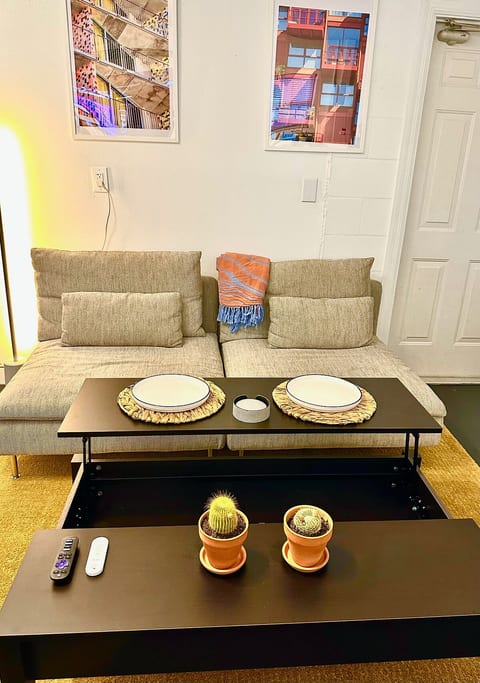 The coffee table lifts up to create a raised surface — perfect for eating, working on a laptop, or extra space when needed. It makes the space more functional for everyday use.
