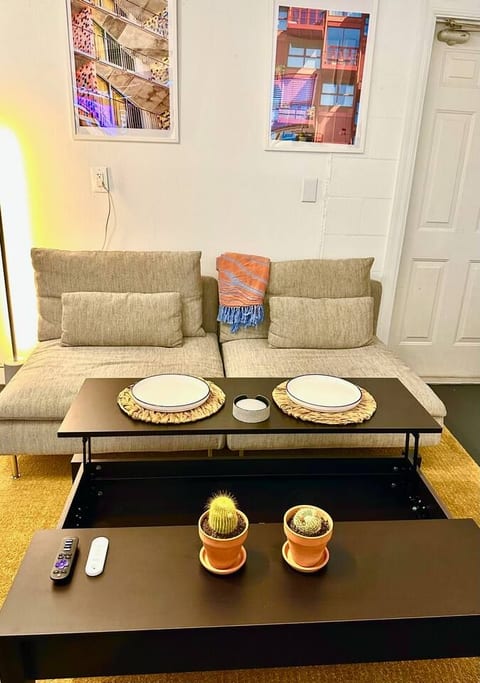 The coffee table lifts up to create a raised surface — perfect for eating, working on a laptop, or extra space when needed. It makes the space more functional for everyday use.