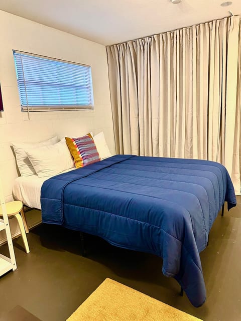 Comfy queen bed — perfect for work or rest. All linens and bed covers get a fresh wash after every stay—spotless and ready for you.