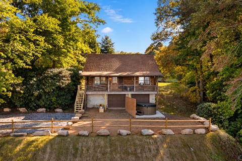 this photo has been edited by AI to show the privacy fence next to the hot tub that is in progress. The stairs are also being replaced.