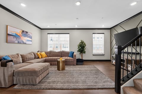 Bright modern living room with oversized sectional and stylish design