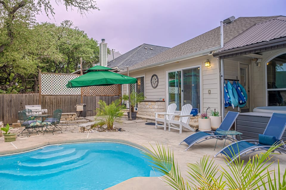 Welcome to your own private Backyard Oasis. Spa jets in pool bench seats & separate hot tub. Natural gas grill, oversized hammock for two, heated pool. Could it get any better?! Come, dive in ️