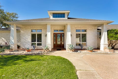Beautiful front entrance of this private ranch-style home in Lago Vista, offering a peaceful and welcoming arrival experience
