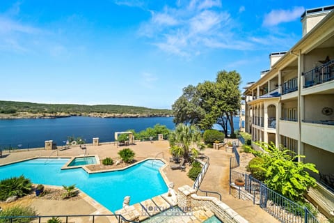 Enjoy beautiful lake views right from the property, with the pool and shoreline just below!