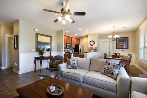 Open living and dining area with comfortable seating, natural light, and easy flow into the kitchen for a relaxed Lake Travis stay.