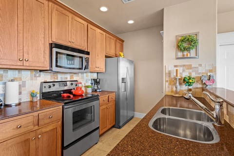Well-appointed kitchen featuring full-size appliances, ample counter space, and everything needed for meals, snacks, and extended stays